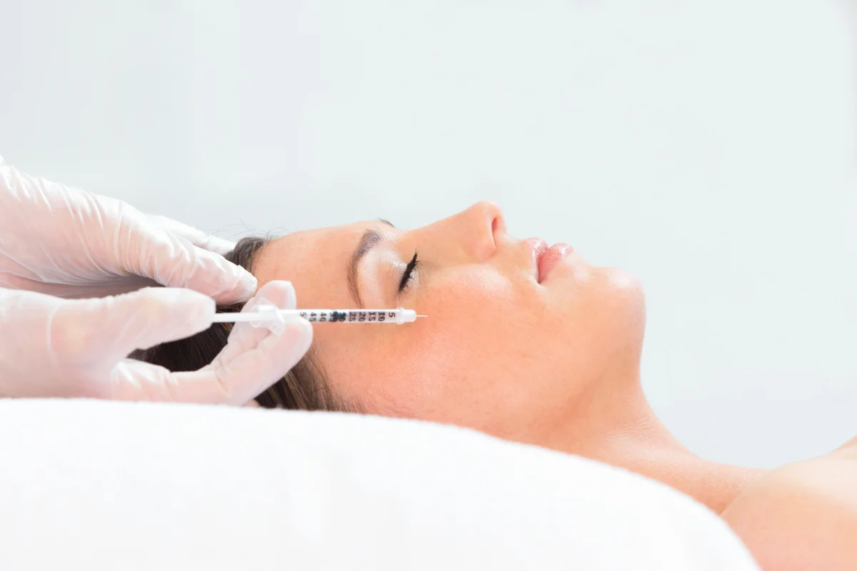 Woman getting Sculptra Aesthetic filler injections at an Asheville medical spa