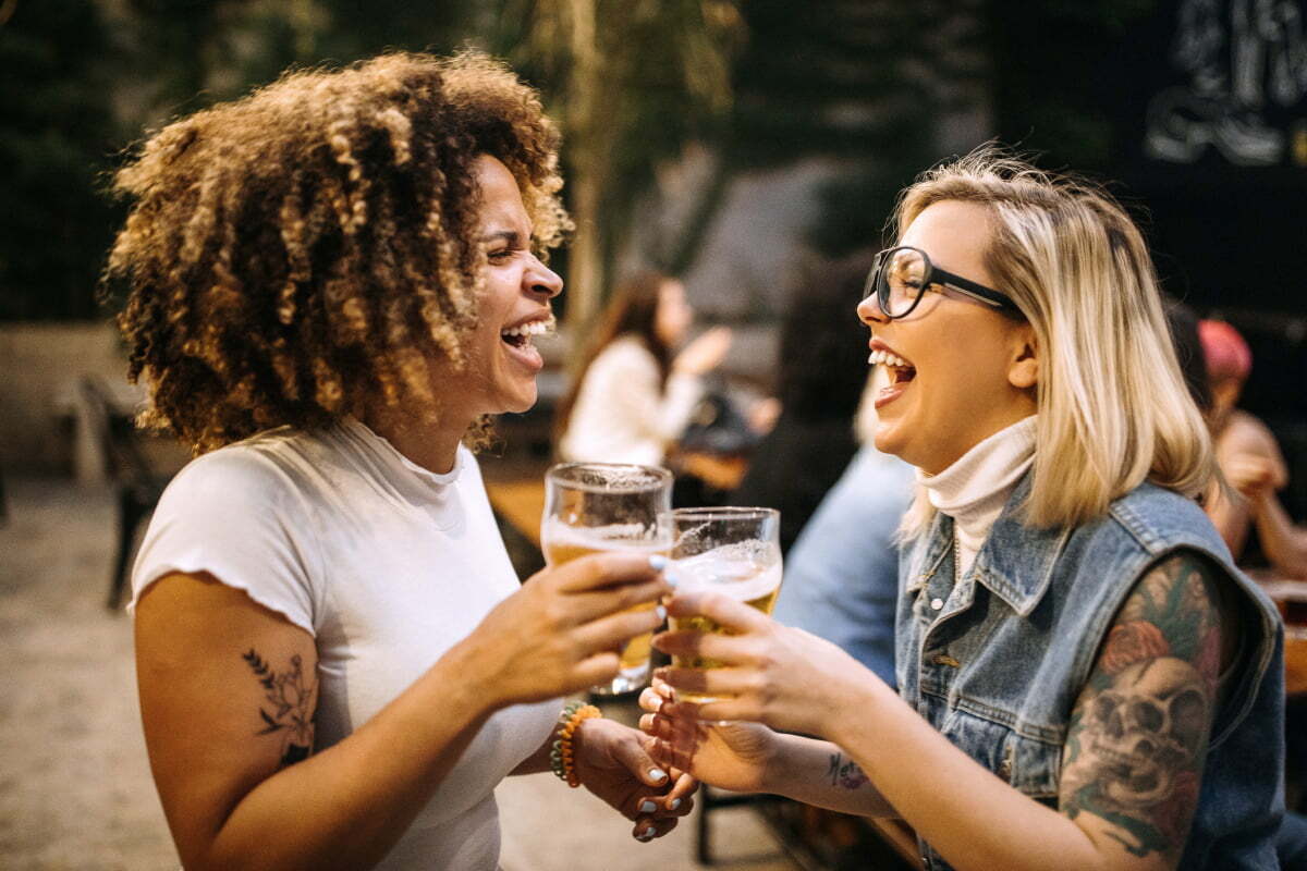 Two Asheville women drinking at a local brewery