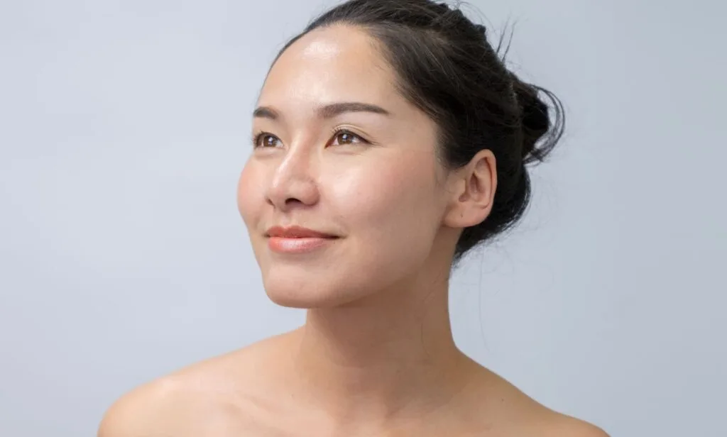 Woman with healthy, fair skin smiling