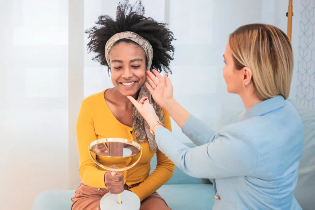 Young woman smiling after her first time at a medical spa