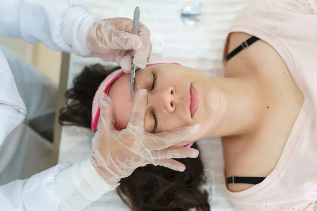 Young woman getting a professional dermaplaning treatment