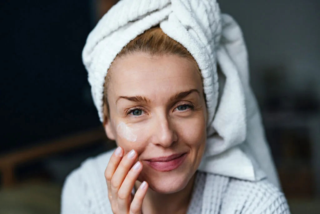 Mature woman using skincare for menopausal skin