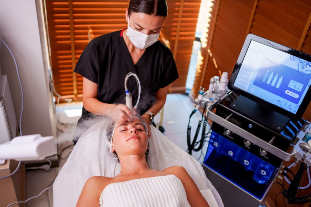 Physician assistant performing Hydrafacial treatment at a med spa