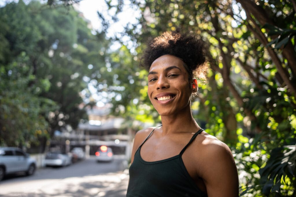 Smiling after gender affirming med spa treatments